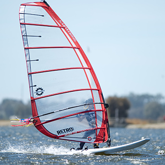 A person windsurfing A person windsurfing