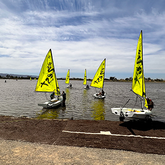 A group of boats being launched. A group of boats being launched.