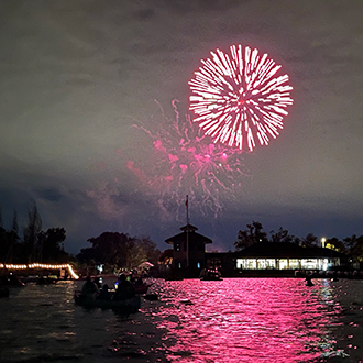Fireworks over shoreline lake. Fireworks over shoreline lake.