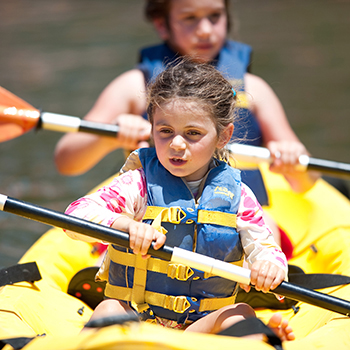 Two girls in a kayak boat Two girls in a kayak boat.